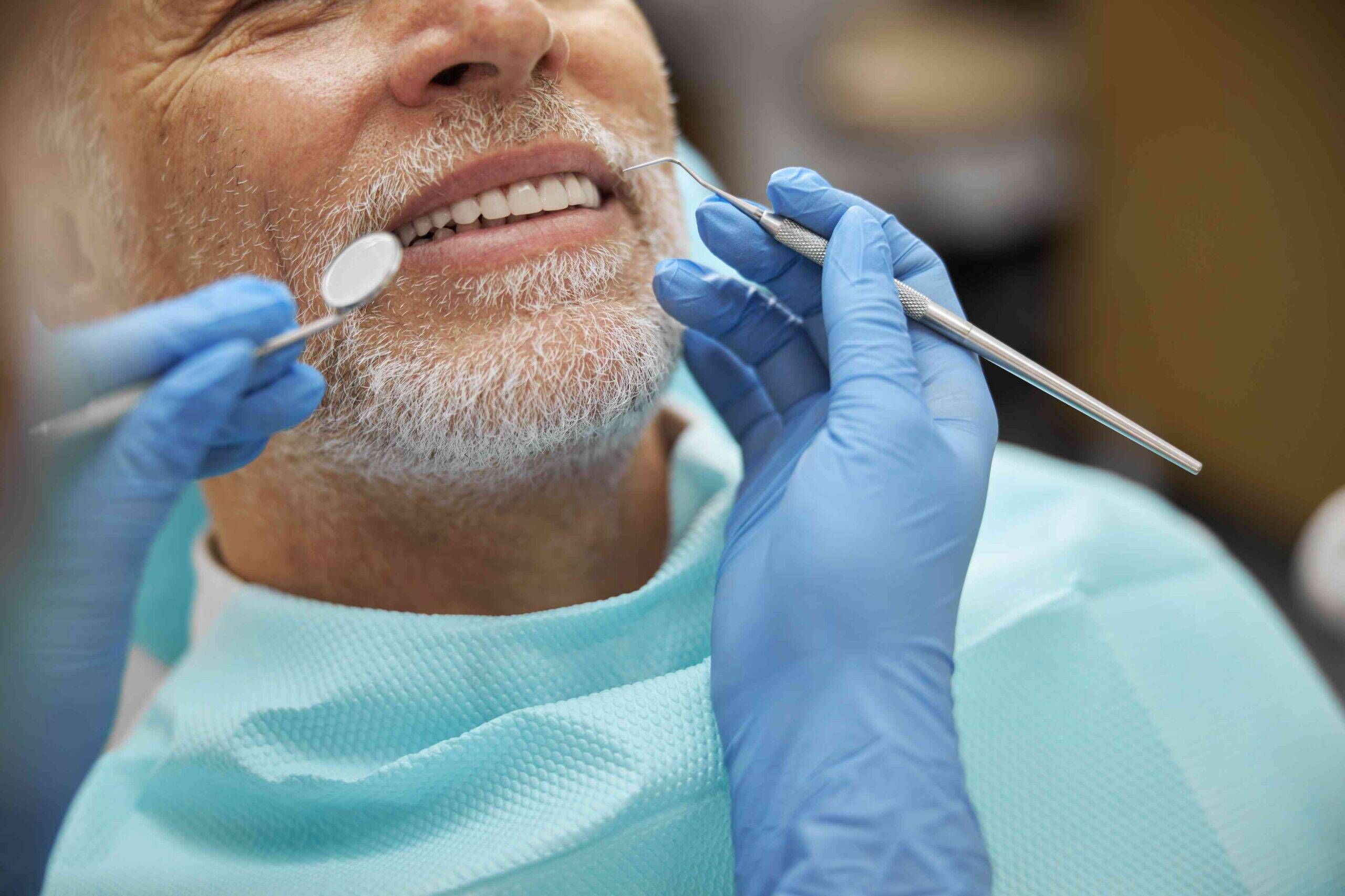 Senior patient receiving a dental exam.